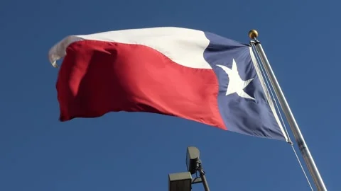 Texas State Flag waving in the Sky daytime Stock Footage 147234644