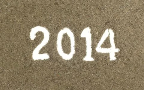 Text 2014 drawing on sand Stock Photos