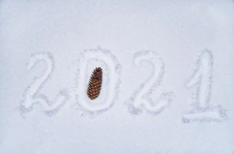 Text 2021 written on the snowy surface, new year, place to copy, flat lay Stock Photos