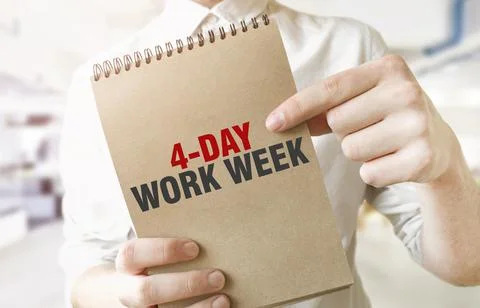 Text 4 day work week on brown paper notepad in businessman hands in office... Stock Photos