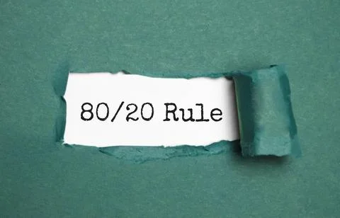 The text The 80 on 20 Rule appearing behind torn brown paper Stock Photos