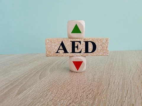 Text Aed on brick block, cubes with arrow up down. Stock Photos