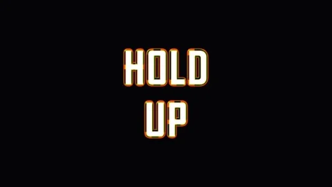 Text animation displaying HOLD UP in bright light against dark background w.. Stock Footage 345621989