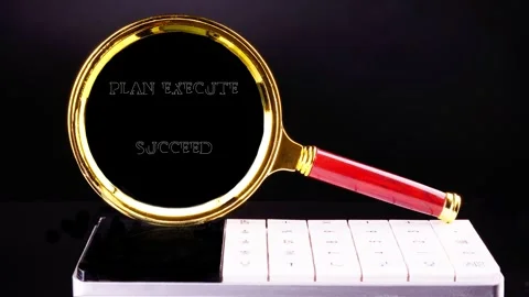 Text animation: PLAN EXECUTE SUCCEED. Close-up of a golden magnifying glass Video stock 330789410