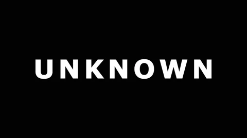 Text animation UNKNOWN title sequence with focus pull and motion blur in da.. Stock Footage 343478976