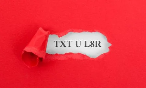 Text appearing behind torn red envelop Stock Photos