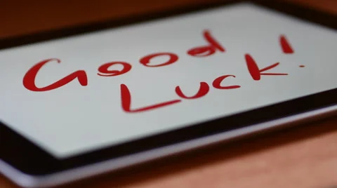 Text Appears On The Tablet Itself. Good Luck! Stock Footage 68512387