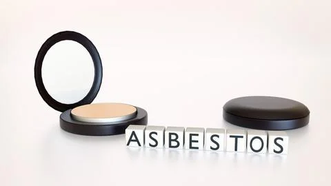 The text "ASBESTOS" on white blocks over an open makeup compact. Stock Illustration