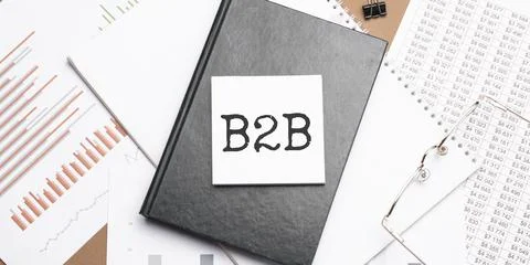 Text b2b on notepad with office tools, pen on financial report . Business and Stock Photos