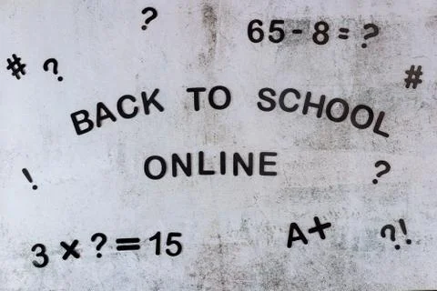 Text back to school online with eguation on white board. Stock Photos