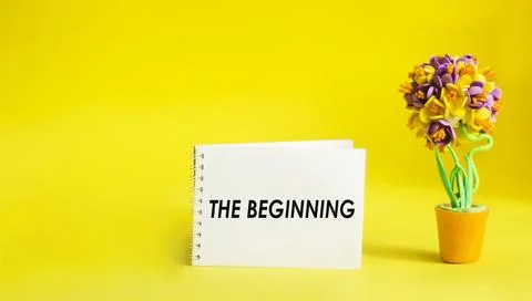 Text Beginning written on a notepad and yellow background Stock Photos