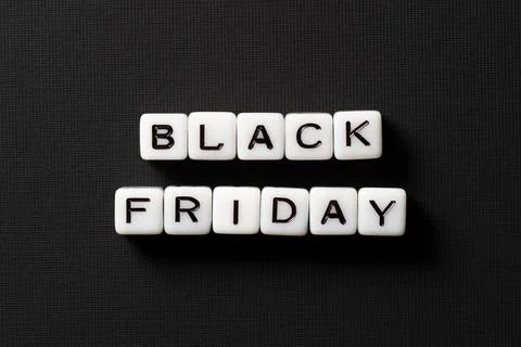 Text "Black Friday" made of beads on a black background. Stock Photos