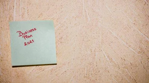 Text Business plan 2021 on post it. Writing on colorful sticky note. Buchar.. Stock Photos