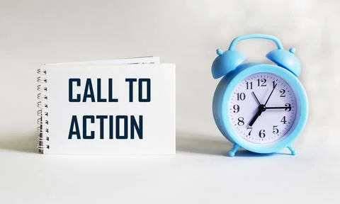 Text Call to Action on notepad and white background with clock. Conceptual im Stock Photos