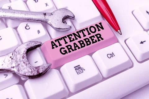 Text caption presenting Attention Grabber. Conceptual photo Demanding notice Stockfoto's