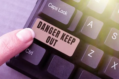 Text caption presenting Danger Keep Out. Concept meaning Warning be alert stay Foto stock