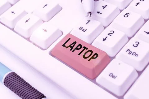 Text caption presenting Laptop. Concept meaning computer that is portable and Stock Photos