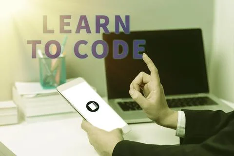 Text caption presenting Learn To Code. Concept meaning Learn to write Software Stockfoto's