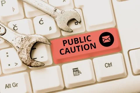 Text caption presenting Public Caution. Word for formal warning given to the 写真素材