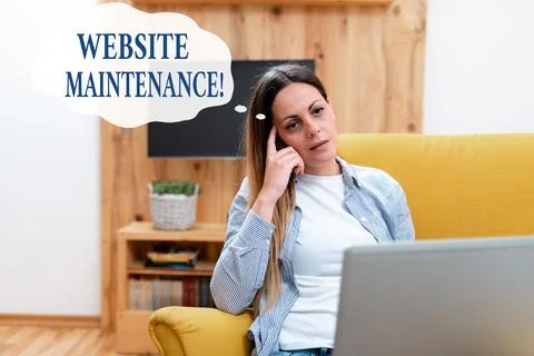 Text caption presenting Website Maintenance. Word for act of regularly checking Stock Photos