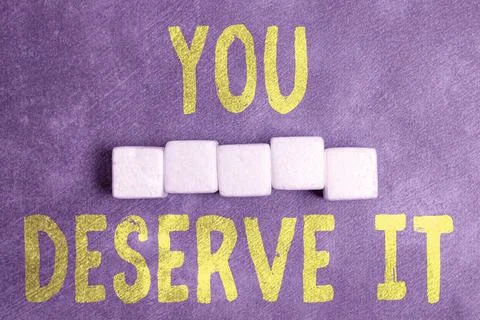 Text caption presenting You Deserve It. Business idea should have it because of Stockfoto's