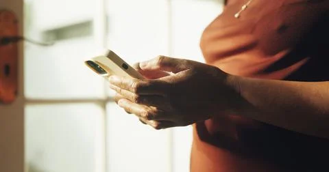 Text, chat and hands in house with phone, online communication and post rea.. Stock Photos