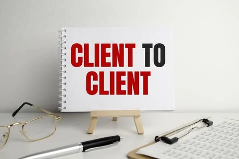 The text client to client appearing behind torn red paper Stock Photos