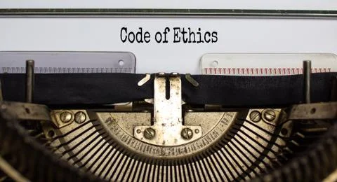 Text 'code of ethics' typed on retro typewriter. Business concept. Beautiful  Stock Photos