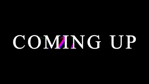 Text 'Coming Up' with subtle RGB color shift and glitch effect in dark stud.. Stock Footage 345620608