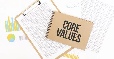 Text Core Values on brown paper notepad on the table with diagram. Business c Stock Photos