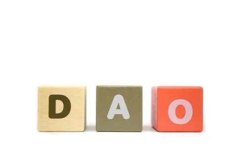 Text DAO Decentralized Autonomous Organizations on colorful wooden Stock Photos