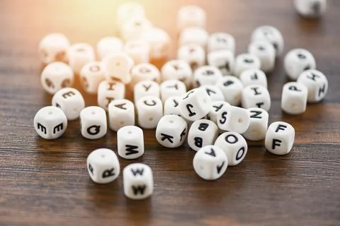 Text dice cube concept Letter dices alphabet on wooden background Stock Photos