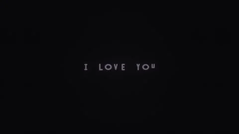 Text displays the message I love you on a dark background Stock Footage 339427615