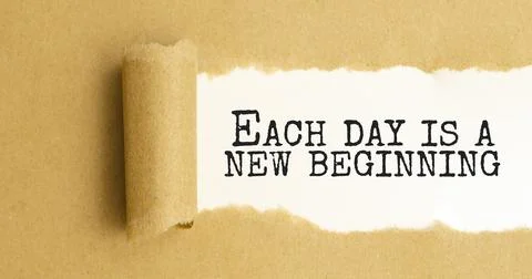Text Each day is a new beginning appearing behind ripped brown paper Stock Photos