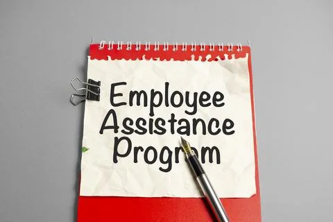 Text EAP Employee Assistance Program text written on red notepad and charts Stock Photos