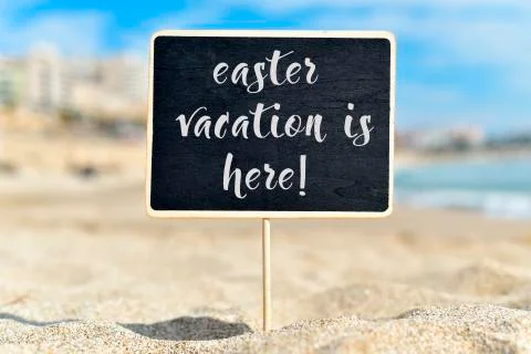Text easter vacation is here in a signboard Stock Photos