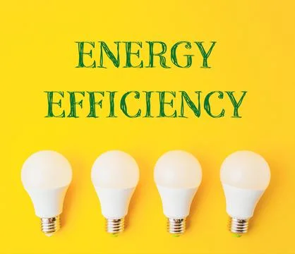 Text Energy Efficiency on a yellow background with light bulbs Stock Photos