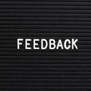 The text feedback on black letter board Stock Photos