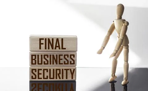 Text FINAL BUSINESS SECURITY. The text is written on wooden blocks, on a whit Stock Photos