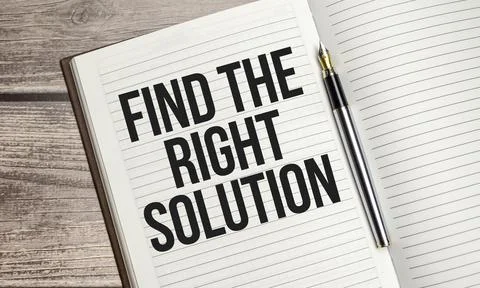 Text Find The Right Solution on brown diary on wooden background Stock Photos