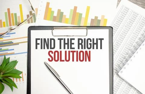 Text Find The Right Solution on file folder with charts and pen Stock Photos