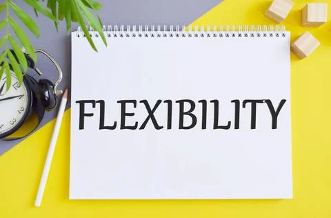 The text Flexibility written on white notebook on office table. Business conc Stock Photos