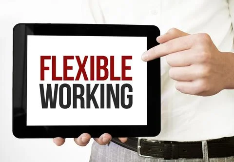 Text FLEXIBLE WORKING on tablet display in businessman hands on the white bak Stock Photos