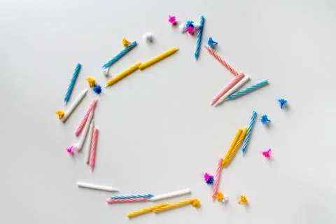 Text frame made of bright colorful birthday candles on white background Stock Photos