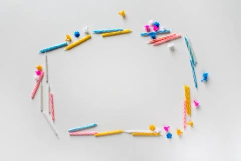 Text frame made of bright colorful birthday candles on white background Stock Photos