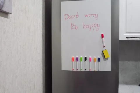 Text on the fridge do not worry be happy Stock Photos