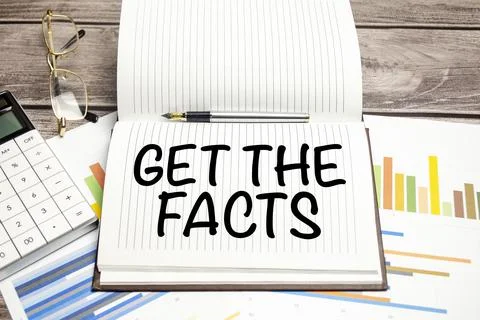 Text Get the facts on brown diary with calculator, glasses on wooden backgrou Stock Photos