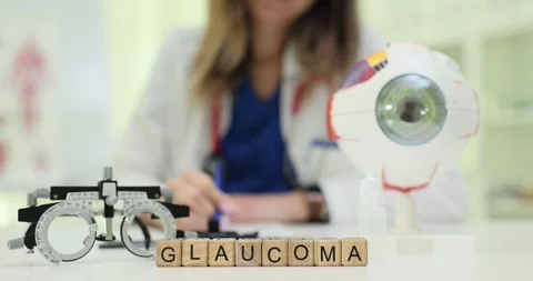 Text Glaucoma on wooden blocks with eyeball model and phoropter Stock Footage 310230860