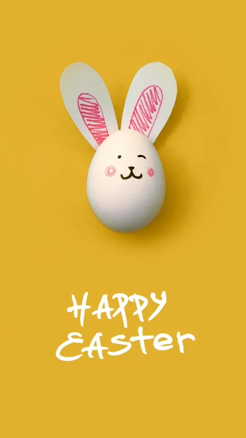 Text Happy Easter and white egg with cute bunny face, paper rabbit ears Stock Footage 303778645