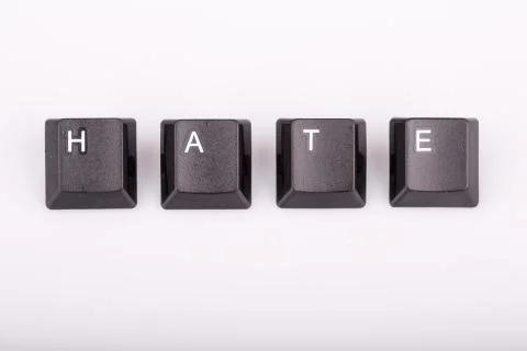Text hate formed with computer keyboard keys on white background Stock Photos